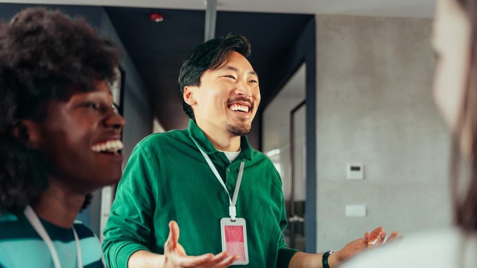 three colleagues laughing