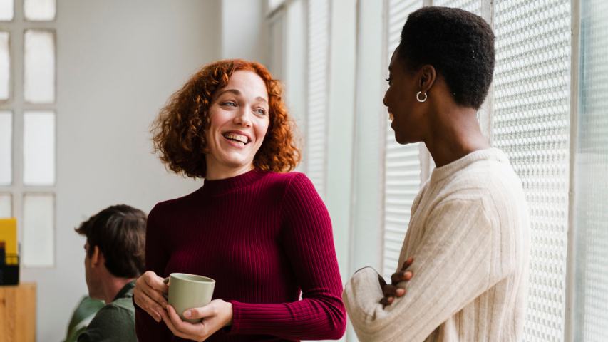 female colleagues talking and laughing