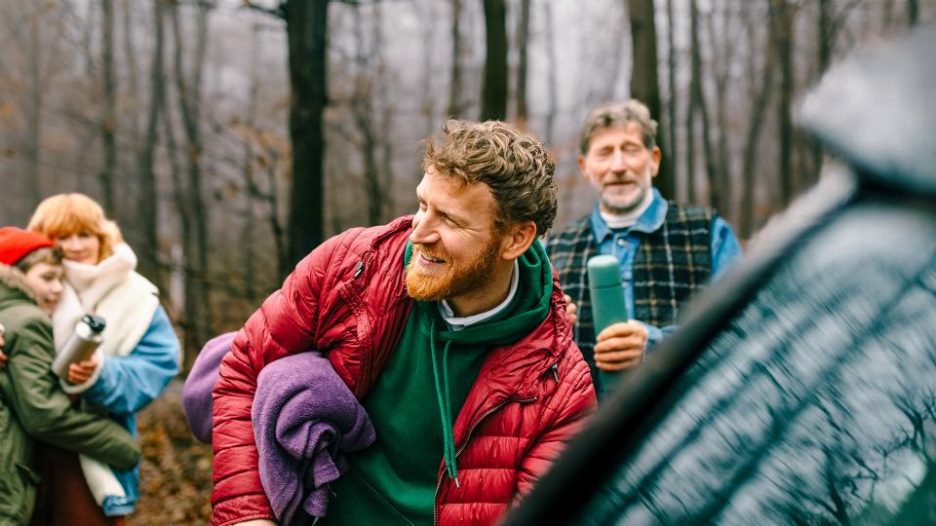 laughing family of four on hiking trip