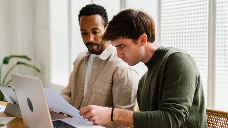 colleagues working together sitting in workspace